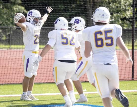 Dan Thorton celebrates his 42-yard touchdown run with members of Warwick Valley’s offense line. Photo by Tom Bushey/WVSD.