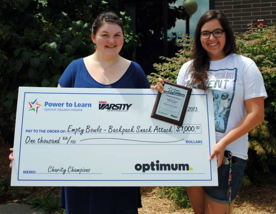 The hunger to help others Warwick Valley High School students Victoria Garloch, left, and Gianna Rotondo, Empty Bowls student representatives, display the ìgiant checkî from Cablevisionís MSG Varsity/Power to Learn Charity Champions program. The award recognized student fund-raising efforts to help Empty Bowls support local organizations, encompassing the entire Town of Warwick, that provide food or meals for town students, senior citizens and families in need.