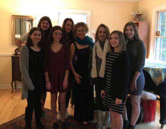 Voice students raise $800 for disaster relief by singing Photo provided by Jody Weatherstone Pictured are: Julia Grunes, Season Ciriello, Camila Scanlon, Mallory Kaufman, Jody Weatherstone, Chloe Borthwick, Sydney Bulla and Emily Ezratty. Alex Lombardo is also a member of this group.