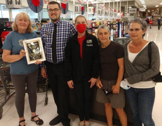 Presenting the Golden Paw Award from left, Celia Ross, VP, Warwick Valley Humane Society; Managers Justin Eltz, Tammy Basil and WVHS volunteers Cindy Molk and Lisa Notturno