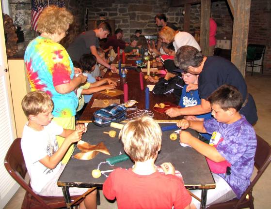 History Camp hosted by Warwick Historical Society Photo by Roger Gavan During a recent rainy morning, the History Camp youngsters and teachers enjoyed activities held in the basement of the Warwick Historical Societyís Bairdís Tavern.