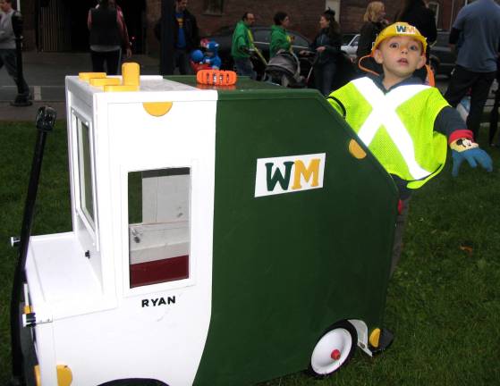 Halloween makes a comeback Photos by Roger Gavan Ryan Olszewski,3, on his Waste Management truck built by his grandfather, John Olszewski.