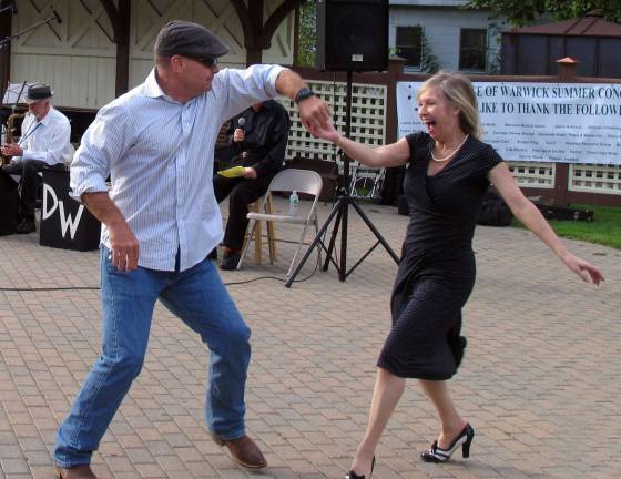September song Phil Pillet of Warwick and professional singer and actress Lynn McCune dance to the band's rendition of "Sing, Sing, Sing," writen by Louis Prima and made famous by Benny Goodman.