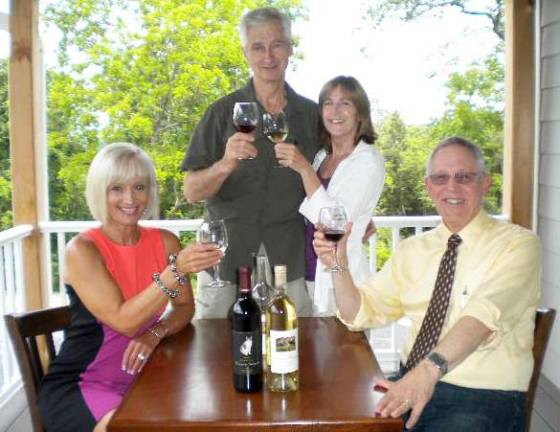 Chamber gets ready for summer mixer at Clearview Vineyard aising their wine glasses in anticipation of The Warwick Valley Chamber of Commerce July 25 Clearview Vineyard business mixer are (left to right) Warwick Valley Chamber of Commerce Board Member Janine Dethmers, co-owners Frank and Karen Graessle and Warwick Valley Chamber of Commerce Executive Director Michael Johndrow raise a glass,