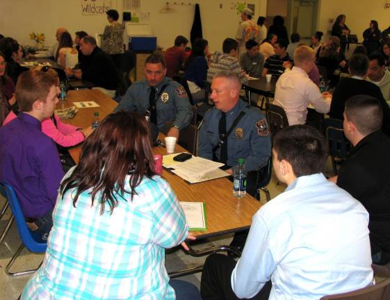 The shadow learns Many students were interested in a career in law enforcement. Talking with the young people were Warwick Police Lt. John Rader and Police Chief Thomas McGovern Jr.