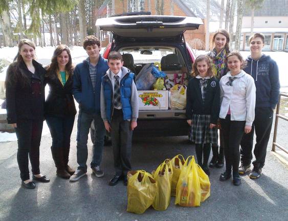 Carry that weight Students from St. Stephen School as well as teen volunteers from Warwick Valley High School helped collect and then deliver more than 1,000 pounds of donations for the Warwick United Methodist Ecumenical Food Pantry. Pictured from left to right are: Sydney Mitchell, Taryn McCormick, AJ Messineo, Brendan McCormick, Olivia Maylor, Kendall Maylor, Alexandra McHale and Colin Mitchell.