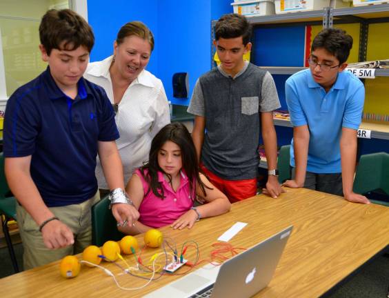 Photo provided by Tuxedo Park School Students and families gathered to celebrate the opening of the KMac Lab at Tuxedo Park School: Matthew and Gabi Biamonte and Max, Sam and Joyce Lachman.