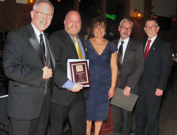 Seventy-five years in the making Each year at the event, the chamber presents awards to four of its most outstanding members. This year's Entrepreneur of the Yea award went to Adam Powers, owner of three Warwick business establishments: Fetch, Village Billiards and Fizzy Lifting Soda Pop and Candy Shop. From left, Executive Director Michael Johndrow Adam Powers, Chamber President Sherry Bukovcan, Mayor Michael Newhard and Town of Warwick Supervisor Michael Sweeton.