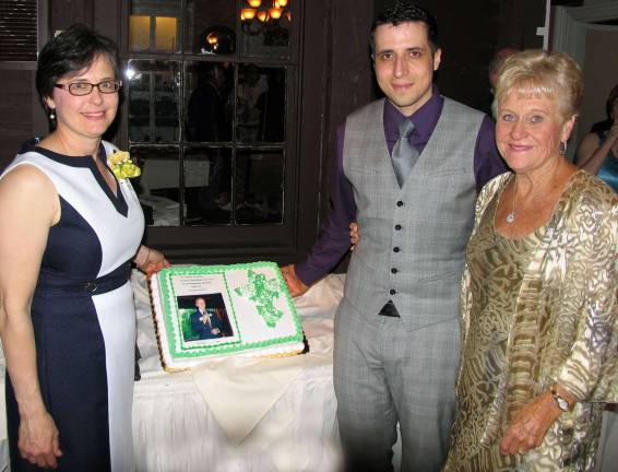 St. Stephen's Educational Trust hosts 18th annual cocktail party Photos by Roger Gavan Preparing to cut the cake, from left, Mary Juliano, newly elected president of the St. StephenþÄôs Educational Trust, Ed SharfenbergerþÄôs grandson, Ian Clark and Ann Vogel, past Secretary and one of the original members of the St. Stephen þÄì St. Edward Board of Trustees.
