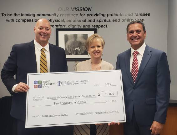 Hospice gifted $10,000 donation Representatives from the Elan Charitable Giving Program present a check for $10,000.