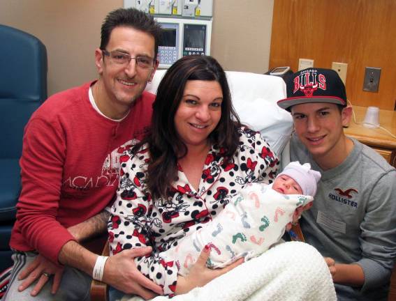 Madison De Rise arrives in the wee hours of 2013 Michael and Jeanine De Rise with their newborn baby girl Madison and her older brother Michael, 17. Madison was the first baby born at St. Anthony Community Hospital's Kennedy Birthing Center in 2013.