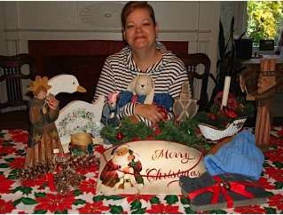 Get ready to shop at Goshen's craft fairs Lori Turner, chairperson of the Deacons Annual Craft Fair at the First Presbyterian Church, Goshen, shows a few of the crafts that will be available on Sat., Nov. 23.