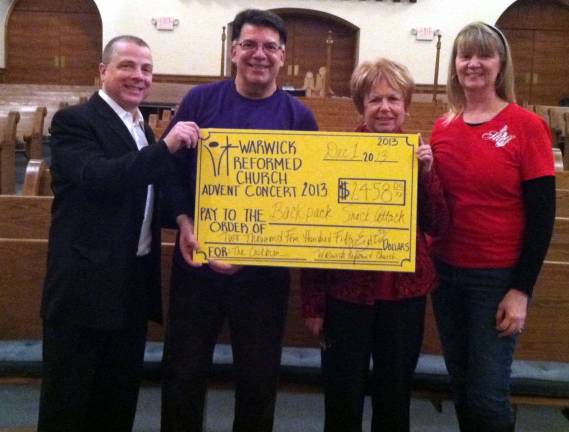 Backpack Snack Attack raises $2,458 at Reformed Church Advent concert Provided photo From left, band leader Michael Tate, Volunteers Joe Sclafani, Backpack Attack Executive Director Shirley Puett and Joanna Barbuto.