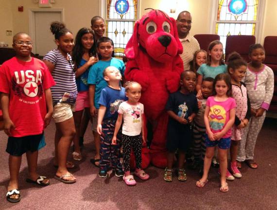 Pajamas, books and Clifford the Big Red Dog Nearly 20 children, many dressed in their jammies, were on hand last Friday when Clifford the Big Red Dog, the famed character of the Scholastic children's book series, made a special visit to Union A.M.E. Church for the first annual Pajama Jam.
