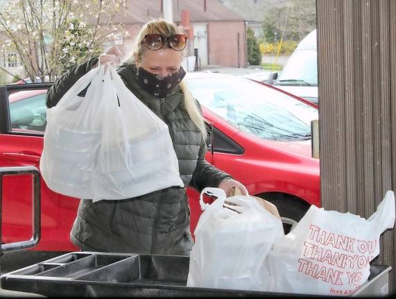 Christie Ranieri of the Tuscan Cafe delivers her meals.
