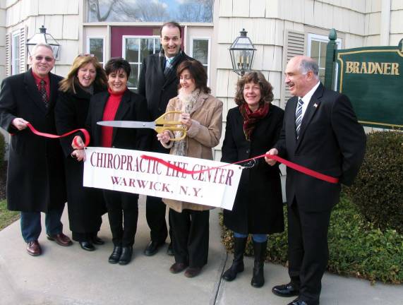 Grand openings Photo by Roger Gavan Chiropractic Life Center celebrates the grand opening at new location. From left: Michael Johndrow, executive director of the Warwick Valley Chamber of Commerce, Board member Caryn Burke, First Vice President Sherry Bukovcan, Chamber President Paul Rafanello, Dr. Ann Studer, Chiropractic Assistant Kimlyn Milne and Town of Warwick Deputy Supervisor James Gerstner. Chiropractic Assistant Mary Hennel was not available for the photo.