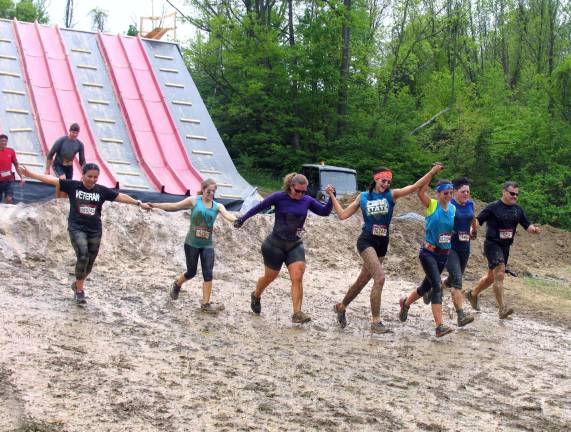 Thousands participate in Warrior Dash at Warwick Day Camp Photo by Roger Gavan Teamwork.