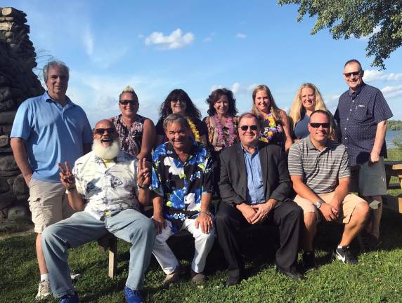 Luau committee members gather at Wickham Woodlands to survey tent and facility locations for the End of the Summer Luau Party to be held Sept. 14. Warwick Rotarians planning the event include, left to right, front row, Wayne Patterson, Stan Martin, Ed Lynch and Travis Polelec; back row, Leo R. Kaytes, Joyce Perron, Patti Lurye Dempster, Tina Buck, Laureen Iammatteo, Laura Barca and David Dempster.