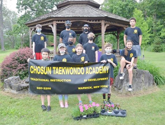 The Chosun Taekwondo Academy Leadership Team at Master Jou’s gazebo in the Warwick Town Park. Pictured from left to right: Bottom row: Luke Cirillo, Kylie Frey, Kamryn Kleveno and Colin Greh. Middle row: Parker Walters, Milo Shaw-Smith Gendelman and Nina Rose Cirillo. Back row: Lucas Greh, Timothy Leonard, Thomas Magee and Maximus Sherman. Not pictured: Gregory Saucedo, Mark Wishnia and Leonardo Blic. Provided photos.