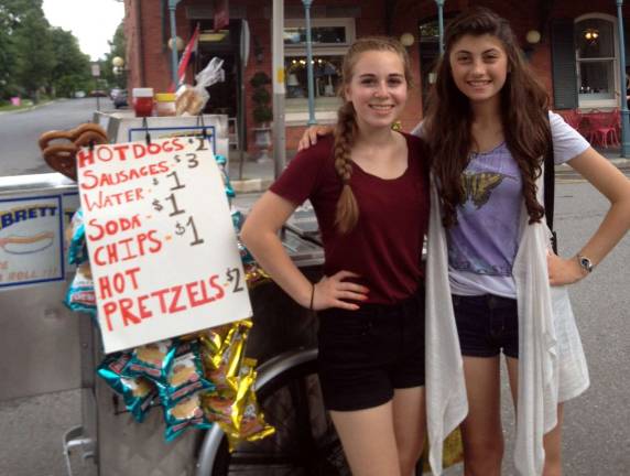 How to pay for college? Hot dogs Warwick Valley High School students Sydney Umberto, left, and Casey Magee have pooled their resources, refurbished a hotdog cart and, with a permit from the Village of Warwick, have begun selling hot dogs and beverages in their effort to set aside money for college.