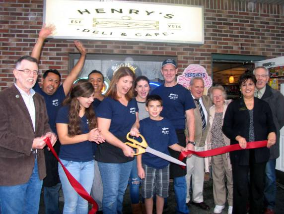 Henry's Deli & Café celebrates grand opening On Thursday, Nov. 6, owners Karen and Philip McKenna, their family, friends and staff celebrated the grand opening of HenryþÄôs Deli & Caf‡©. From left, Town of Warwick Supervisor Michael Sweeton, employee Guillermo Jimenez, daughter Maeve McKenna, employee Miguel Chinas, co-owner Karen McKenna (cutting ribbon), daughter Fiona McKenna, son Henry McKenna, co-owner Philip McKenna, friends Patrick and Anita Colman, Sherry Bukovcan, president of the Warwick Valley Chamber of Commerce and Chamber Executive Director Michael A. Johndrow. Not present for the photo employee Dylan Hummer.