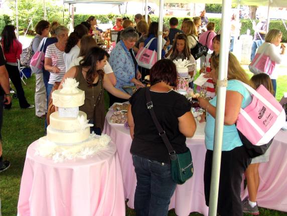Business community year in review 2012 All Bridal Trail visitors were invited to attend a reception under the tent chaired by Michael Bagley and courtesy of his bakery, Favís Treatery, and Jean-Claudeís Artisan Bakery. Emcee Mike Villanueva proposed a Champaign toast to all the brides-to-be courtesy of Peckís Wine and Spirits.