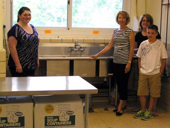 Helping those who help From left, Victoria Garloch, founder of the Warwick Community Kitchen, and Church Special Gifts Committee members Mary Sellers, Lisa Mears and Kent Mears.