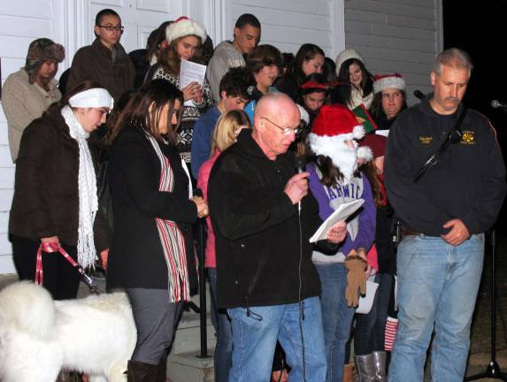 Photos by Roger Gavan Raymond Hose Company Chaplain Barry O&#xed;Neil offered a special prayer just before Chief Dan Schweikart led the crowd with the official countdown and tree lighting.