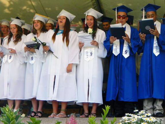 S.S. Seward Institute Class of 2014 Students sang along to FloridaþÄôs S.S. Seward Institute's Alma Mater to conclude the high school graduation ceremony on Saturday, June 28.
