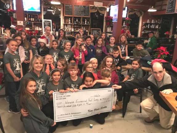 Art-n- Soul kids spread holiday cheer and donate $758 to food pantry Photo provided by Kim ScottoSanfordville and Park Avenue Elementary students present a symbolic check for $758 to Warwick Ecumenical Food Pantry Director Glenn P. Dickes, right.