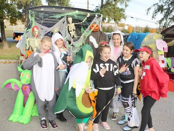 Trunk or Treat event raises $1,500 for St. Stephen – St. Edward Elementary School Students from St. Stephen - St. Edward Elementary School enjoy some clowning for the camera in front of the On the way to the graveyard entry.