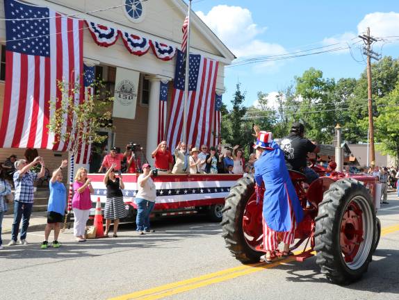 Village of Warwick celebrates 150 years Uncle Sam arrives by tractor at the parade.
