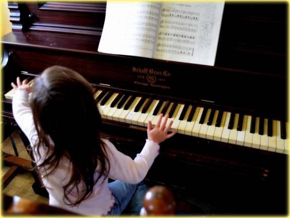 Early musical training helps hearing in later life Little Esme playing the piano!