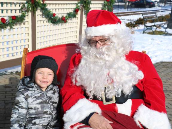 Santa pays another visit to Railroad Green during Home for the Holidays Photo by Roger Gavan Parker Holmgren, 4, not only asked Santa for a toy crane but had specific instructions on how it should be configured.