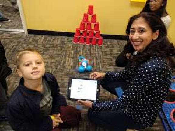 Kids become engineers at Robotics4U Monali Verma with a young enthusiast (Photo by Ginny Privitar)