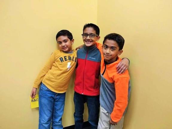 Kids become engineers at Robotics4U Anish Sinha, Arnav Sinha, and Anay Verma, cousins and robot aficionados (Photo by Ginny Privitar)