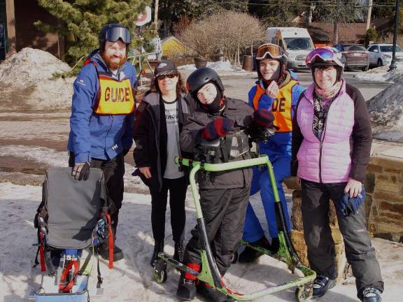 Mountain Creek provides winter recreation for visitors with special needs Tim Stone, Director of Snow Sports at Mountain Creek, mom, Pattie Cerrato, Nick Cerrato, guide Martin and Adaptive Sports Program co-founder Buffy Whiting help Nick get ready for some fun on the slopes. Photo: Dr. John T. Whiting