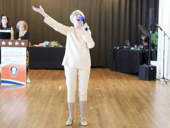 Lynne Arnold belts out a parody of the song “Memory” during the talent portion of the pageant.