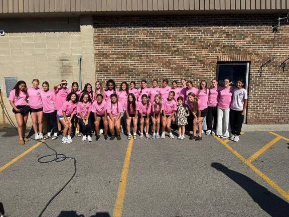 Soccer teams get sudsy The girls soccer team took the first shift washing cars.