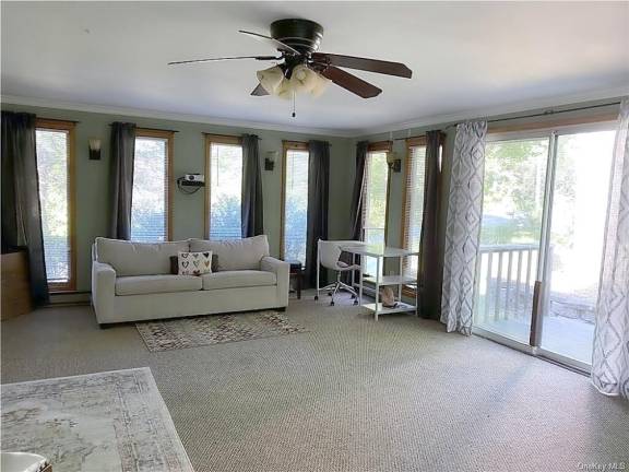 House on country road perched near village and outdoor recreation