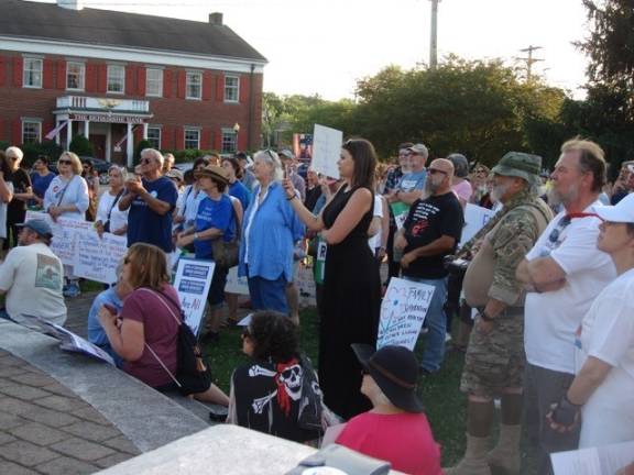 Hundreds speak up for undocumented children at the border The crowd listened to speakers (Photo by Geri Corey)