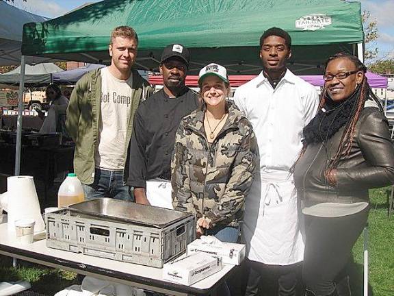 Focused on reducing food waste and feeding the hungry in Orange County are (from left): Ermin Siljkovic, Orange County Recycling Coordinator; Carl Splatt, chef; Kelly Collins, volunteer; Rackwon Lowe, program volunteer; and Charlene Woodson, manager.