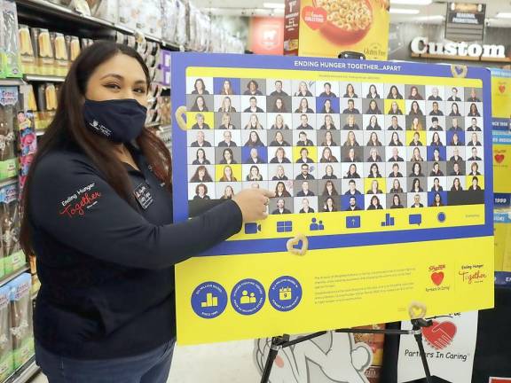 Winner Gabriella Tapia points to her photo, which appears on the back of thousands of editions of special-edition Cheerios boxes.