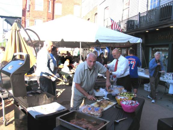 Grappa Ristorante's outdoor barbeque raises nearly $5,000 for Backpack Snack Attack Grappa not only donated all the food and beverages for the event but all staff members volunteered their time. Some of the regular customers and friends even helped with the barbecue. Bill Iurato, owner of Peck's Wines and Spirits, served hamburgers.