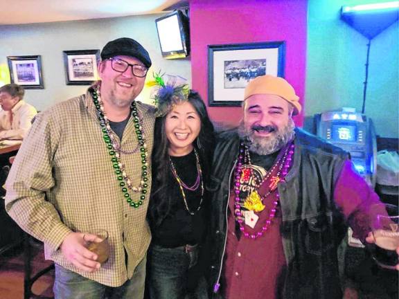 Beads and bright Mardi Gras colors were adorned by many attendees.