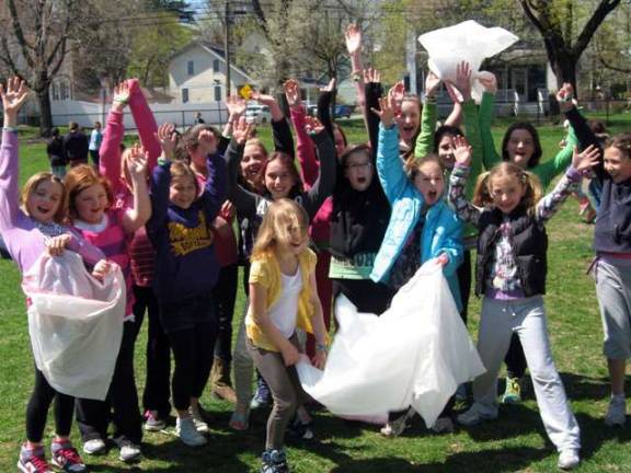 ‘One planet, one people, one Warwick’ Photo provided by Peggy Gavan Children carried garbage bags as part of about celebrating Earth Day with the walk to Stanley-Deming Park.