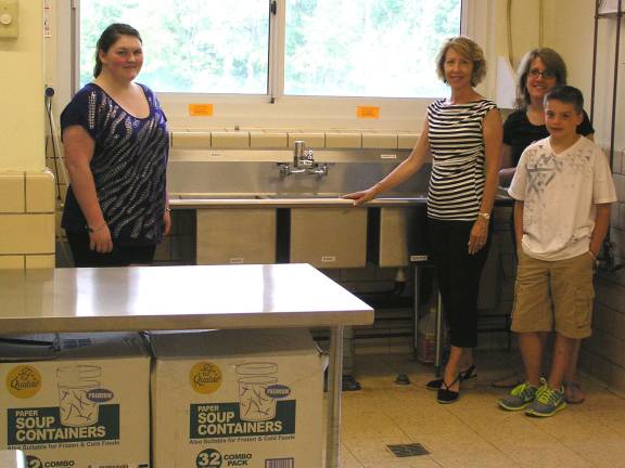Warwick United Methodist Church donates to the Warwick Community Kitchen From left, Victoria Garloch, founder of the Warwick Community Kitchen and Church Special Gifts Committee members Mary Sellers, Lisa Mears and Kent Mears.
