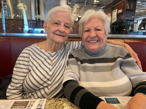 Vincenza Denisi Miller (left) and Maria Trovato Holzhauer reunited for the first time in 56 years at the Goshen Diner in 2020. Vincenza had not seen Maria since Maria’s wedding in 1964 in Elmhurst, Queens.