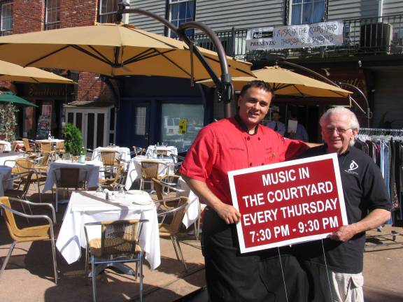 Music in the Courtyard now in its ninth season Photo by Roger Gavan Tony Sylaj, co-owner of Grappa Ristorante, and George Laurence, owner of the Eclectic Eye, invite everyone to come down to Railroad Avenue on Sunday afternoons and Thursday evenings and enjoy Music in the Courtyard.