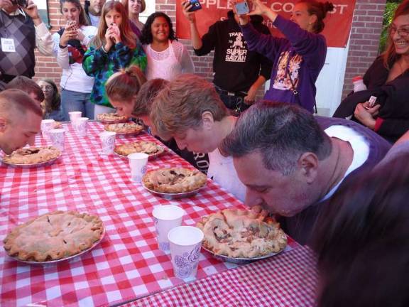 No hands allowed Photo provided On your mark: Hungry adults get ready to devour a full apple pie made by Noble Pies at Applefest. This year, the pie-eating contest is again set, with different youth divisions and an adult division. Winners get, what else, pies!